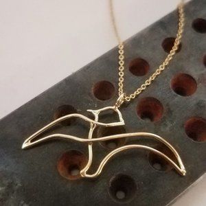 Gold necklace. 14 karat solid yellow gold necklace a bird pendant. Handmade